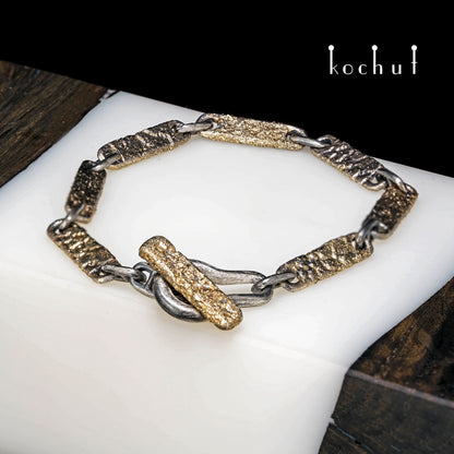 Leib und Seele — Armband aus oxidiertem Silber und gelbem Gold gefertigt
