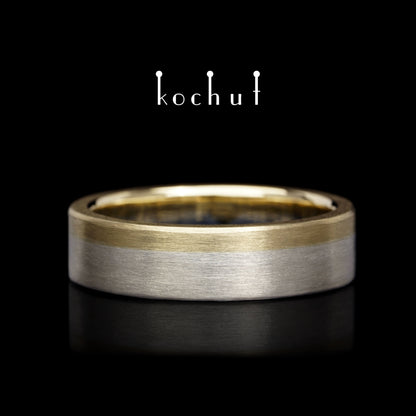 Die letzte Grenze – flach geformter Ehering aus Gelbgold und Sterlingsilber
