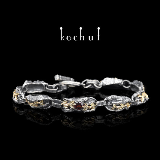 Kraft des Lebens — Armband aus oxidiertem Silber und Gelbgold mit Granat