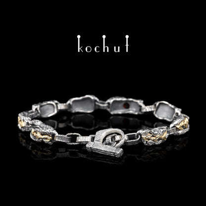 Kraft des Lebens — Armband aus oxidiertem Silber und Gelbgold mit Granat