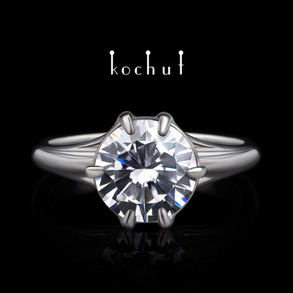 Melian — Verlobungsring aus Weißgold mit einem Diamanten, rhodiniert mit Weißrhythm.