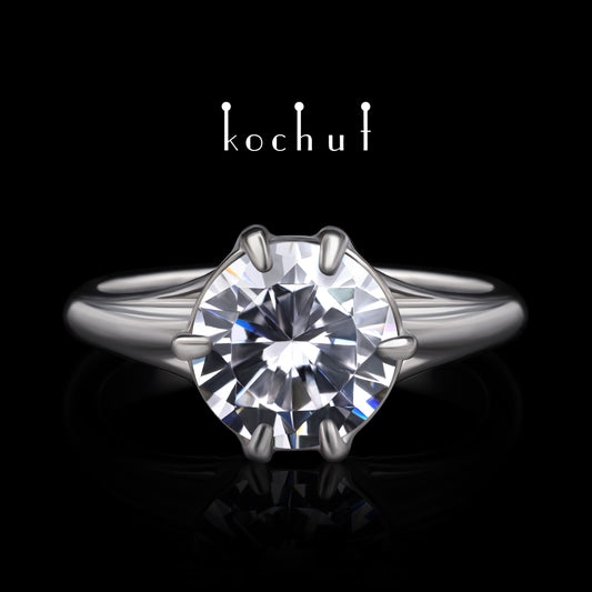 Melian — Verlobungsring aus Weißgold mit einem Diamanten, rhodiniert mit Weißrhythm.