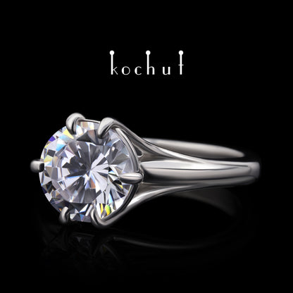 Melian — Verlobungsring aus Weißgold mit einem Diamanten, rhodiniert mit Weißrhythm.